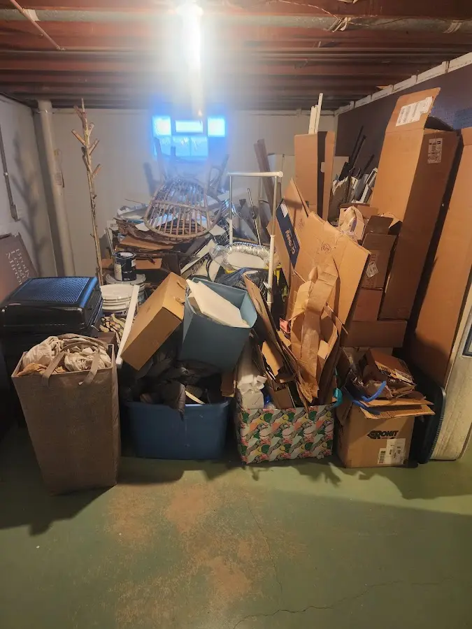 Roll-off dumpster container at job site for 2 Yard Dumpster Rental in Dakota Ridge